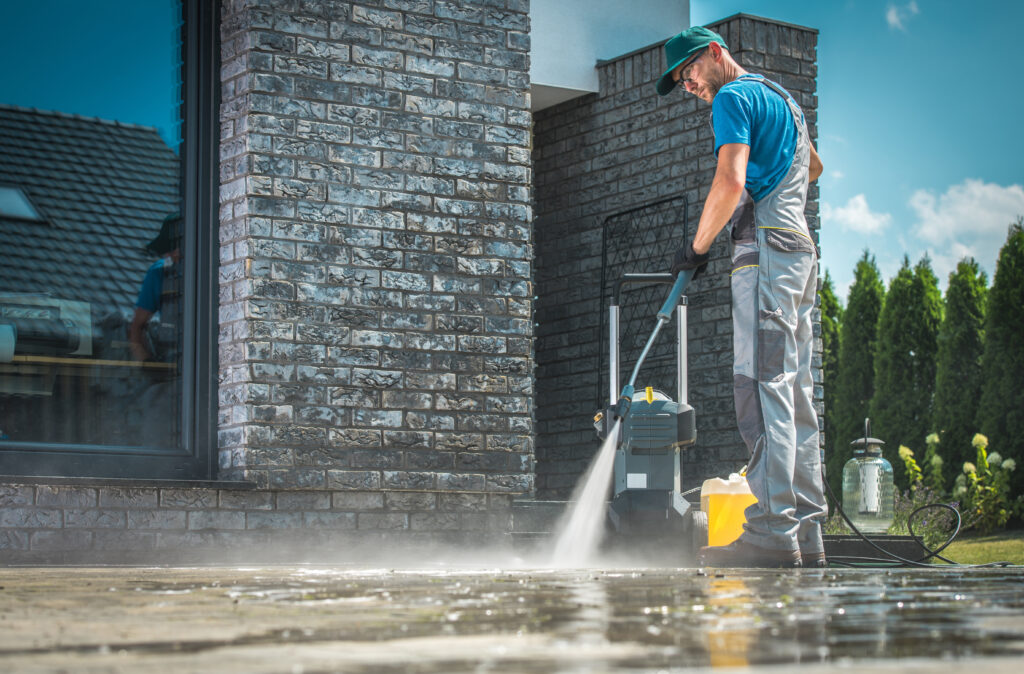All American Pressure Washing professional pressure washing a walkway