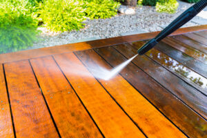 pressure washing a beautiful wooden deck